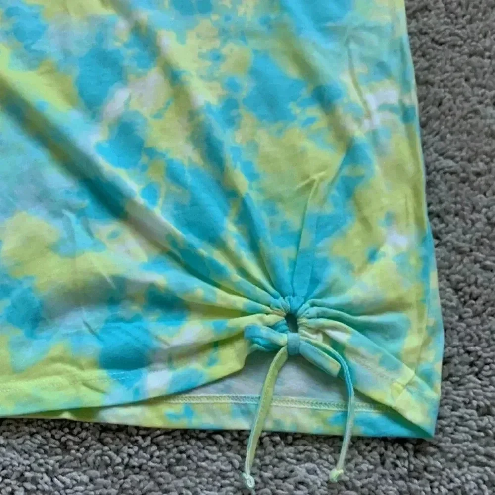 Girls tie dye shirt with cute detail on the bottom right part of the shirt
